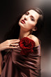 chocolate colored attractive woman with red rose