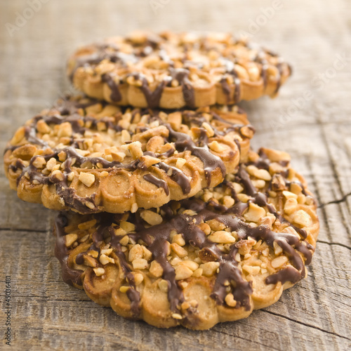 Photo: chocolate chip cookies on wooden table (selective focus) chocolate chip cookies on wooden table (selective focus)
