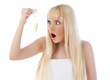 Surprised woman holding condom