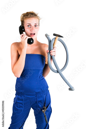 Photo: woman in overalls with tools calling for help woman in overalls with tools calling for help