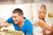 couple eating different food