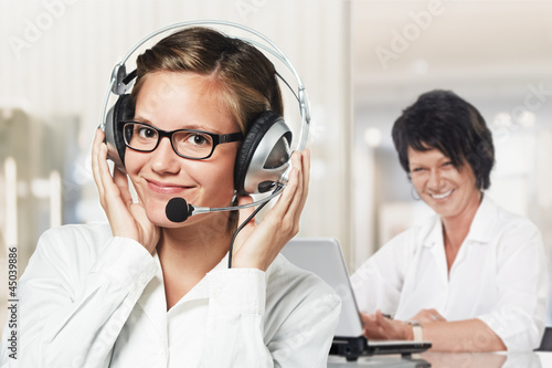 Photo: two women listening to you two women listening to you