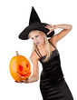 Beautiful sorceress with pumpkin. isolated on white background