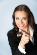 Business woman pointing finger at viewer