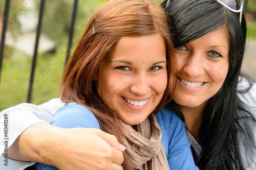 Photo: Mother and daughter in the park smiling Mother and daughter in the park smiling