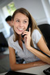 Beautiful office worker talking on the phone