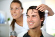 Hairdresser applying hair gel