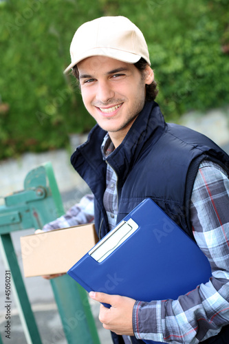 Photo: Portrait of smiling delivery man Portrait of smiling delivery man