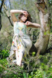 beautiful girl in green wood by summer