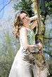 beautiful girl in green wood by summer