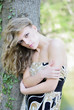 beautiful girl in green wood by summer