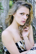 beautiful girl in green wood by summer