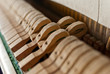 Upright black piano hammer detail