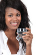 Young woman holding a glass of water