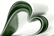 Selective focus image of magazine folded into a heart shape