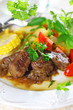 Photo: Beef stew with vegetables and salad of fresh tomato. Beef stew with vegetables and salad of fresh tomato.