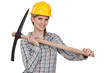 Tradeswoman holding a pickaxe