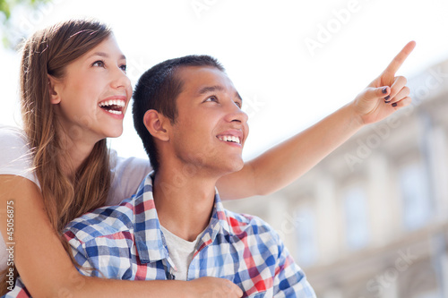 Photo: Young couple pointing Young couple pointing