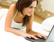 Cheerfull smiling woman working with laptop