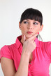 Thoughtful woman with her hand on her chin