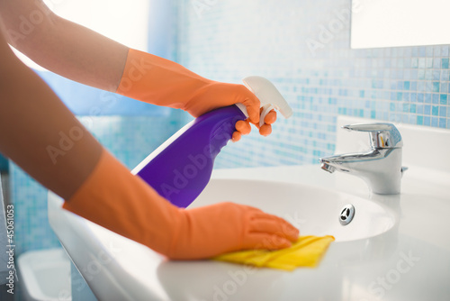 Photo: woman doing chores cleaning bathroom at home woman doing chores cleaning bathroom at home