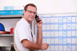 worker planning on a board