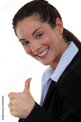 Photo: Excited woman giving the thumb's up Excited woman giving the thumb's up