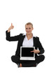 Happy businesswoman showing laptop