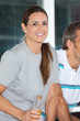 Woman Holding Juice Bottle In Health Club