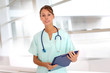 Portrait of beautiful nurse standing in hospital