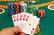 Royal flush cards holding in hand