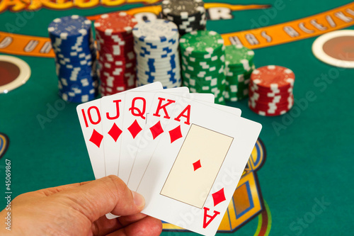 Photo: Royal flush cards holding in hand Royal flush cards holding in hand