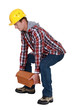Tradesman lifting shingles