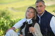 Married couple tasting wine