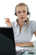 Woman having a hands-free telephone conversation