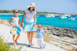 Foto: Family of three walking along tropical beach Family of three walking along tropical beach