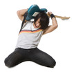 "Young man kneeling and playing electric guitar, studio shot"