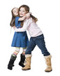 Studio portrait of two girls (4-7) embracing