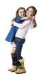 Studio portrait of two girls (4-7) embracing