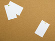 Three blank papers pinned to notice board
