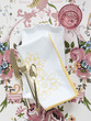 Plate with napkin and cutlery on floral tablecloth