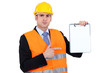 Engineer pointing to a clipboard