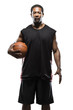 Studio portrait of male basketball player holding ball