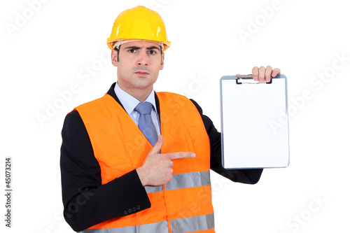 Photo: Engineer pointing to a clipboard Engineer pointing to a clipboard