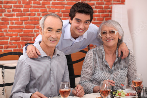 Photo: Elderly couple and grandson in restaurant Elderly couple and grandson in restaurant