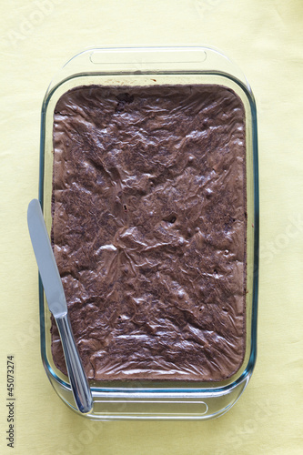 Photo: Chocolate cake in serving dish with knife Chocolate cake in serving dish with knife