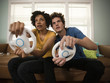 "USA, Utah, Provo, young couple playing video games in living room"