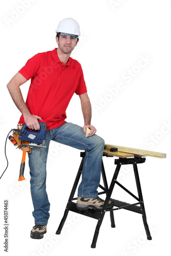 Photo: Carpenter with band saw Carpenter with band saw