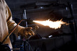 "USA, Utah, Orem, male welder with blowtorch in workshop"