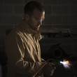 "USA, Utah, Orem, male welder using blowtorch in workshop"